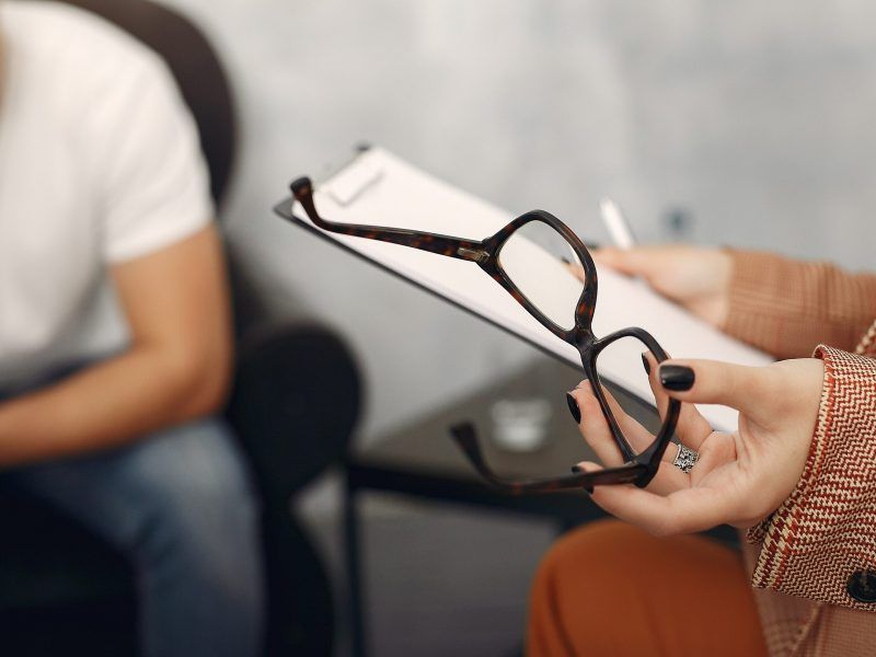 In the psychologist's office. Man and woman talking